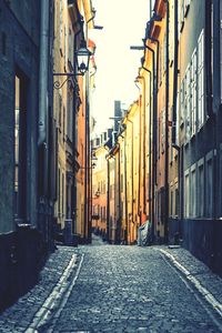 Narrow alley amidst buildings in city