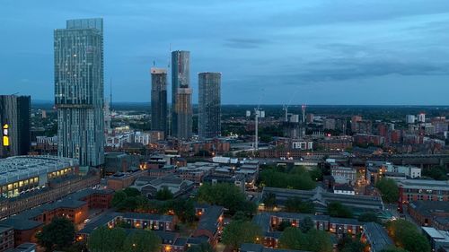 High angle view of buildings in city against sky