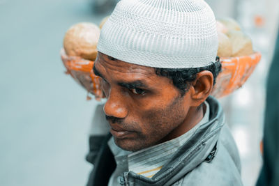 Close-up portrait of man wearing hat