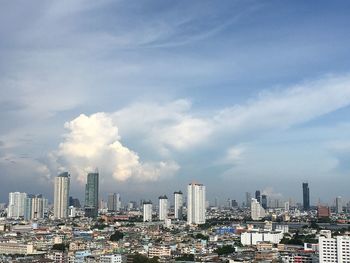 Modern buildings against sky in city