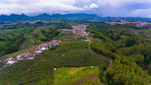 High angle view of buildings in city against sky