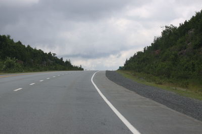 Surface level of empty road against sky