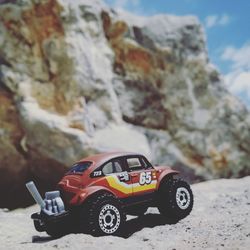 Toy car on rock