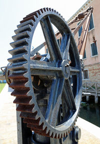 Close-up of rusty wheel in container