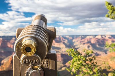Close-up of coin-operated binoculars against sky at grand canyon national park
