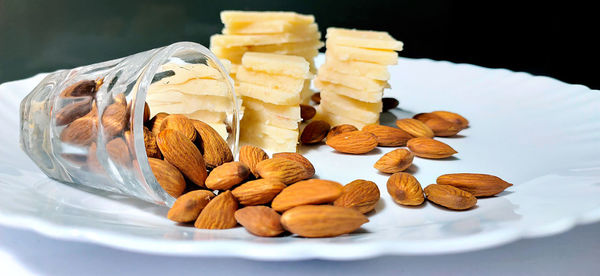 Close-up of sweet food on table against black background