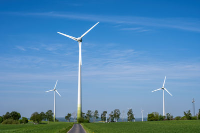 Low angle view of windmill against sky