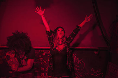 Woman in traditional clothing at nightclub