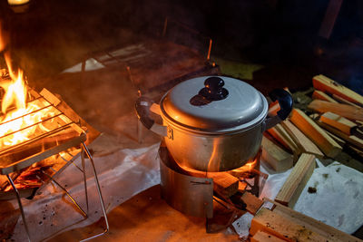 High angle view of fire on barbecue grill