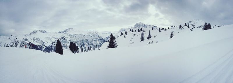 Low angle view of snow covered mountain against sky