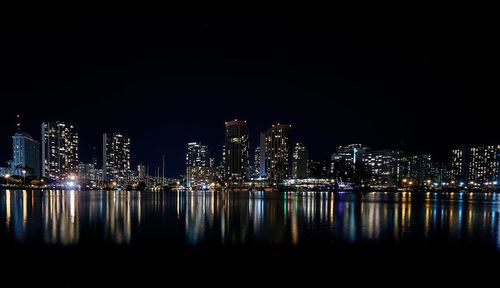 Night view of urban skylines illuminated at waterfront