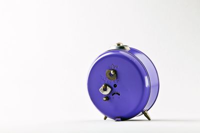 Close-up of clock over white background