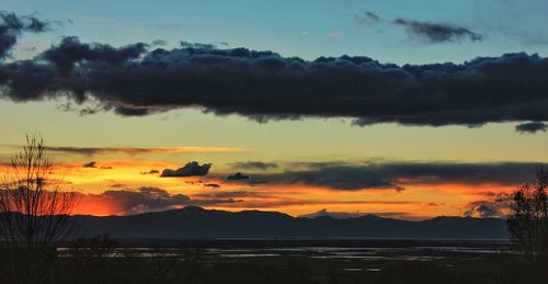 Scenic view of landscape against sky during sunset