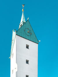 Low angle view of building against clear blue sky