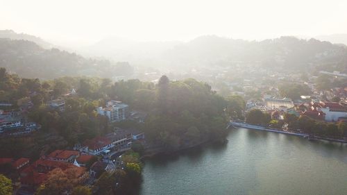 High angle view of river amidst buildings in town