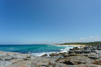 Scenic view of sea against clear blue sky