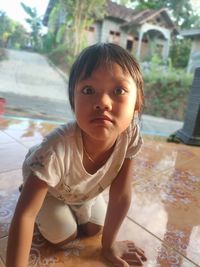 Portrait of cute boy on floor