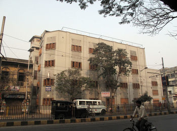 Street amidst buildings in city against sky