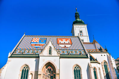 Low angle view of building against blue sky