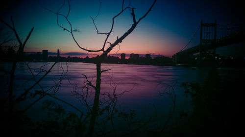 Silhouette of city at sunset