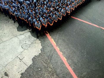 High angle view of policemen gathered on street