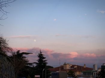 Low angle view of building against sky at sunset