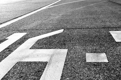 High angle view of arrow symbol on road