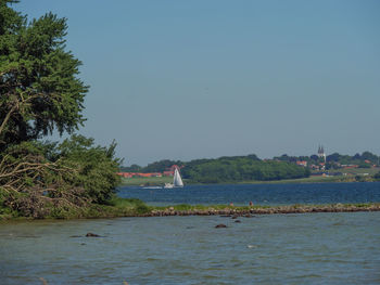 Scenic view of sea against clear blue sky