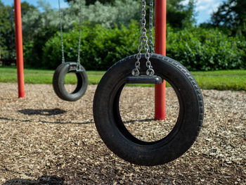 Close-up of playground against trees in park