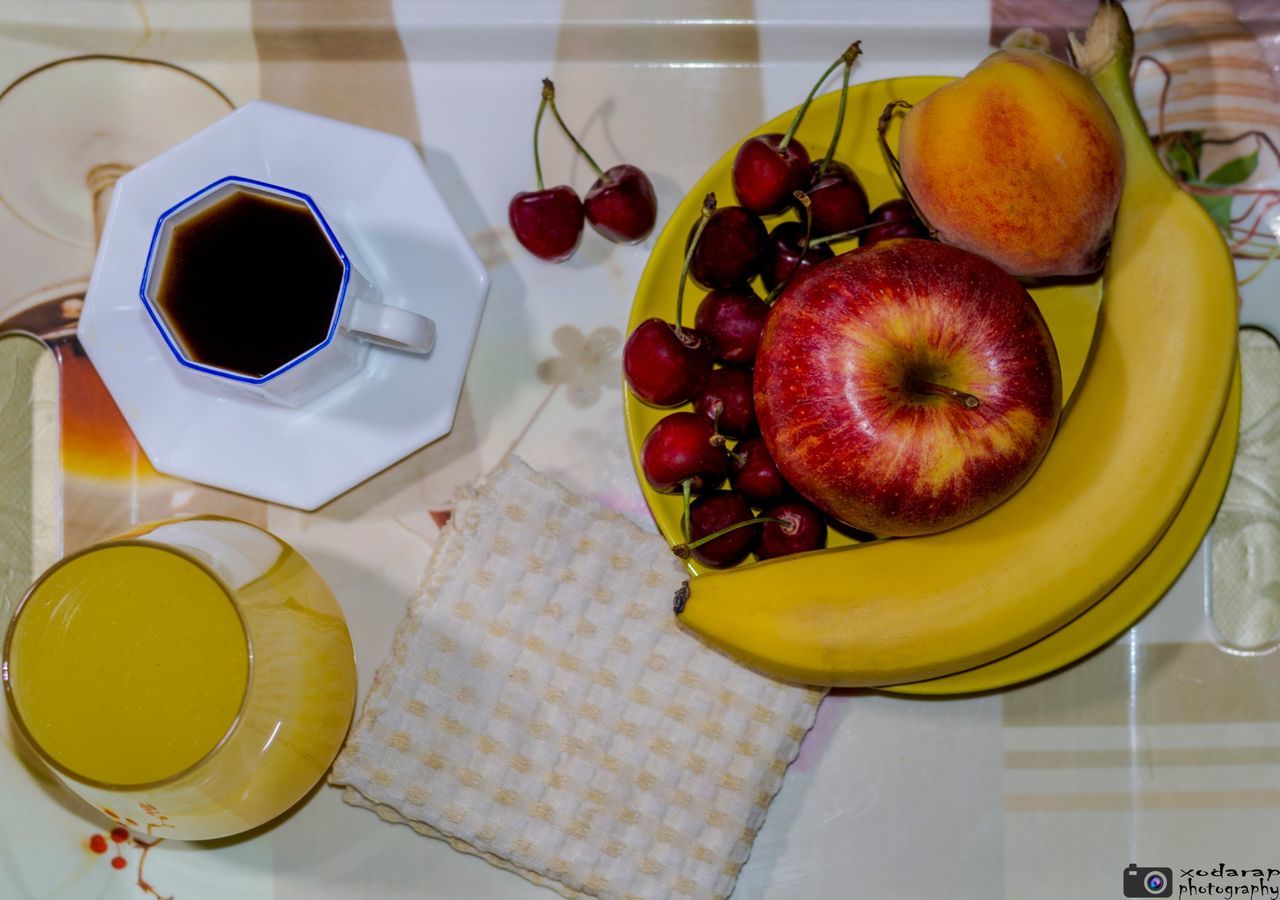 food and drink, food, freshness, indoors, still life, fruit, table, plate, healthy eating, drink, sweet food, high angle view, refreshment, ready-to-eat, breakfast, coffee cup, slice, dessert, indulgence, banana