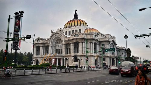 View of buildings against cloudy sky