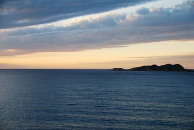 Scenic view of sea against sky at sunset