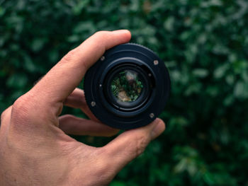 Close-up of hand holding camera