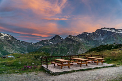 Scenic view of snowcapped mountains against sky during sunset