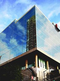 Low angle view of building against cloudy sky