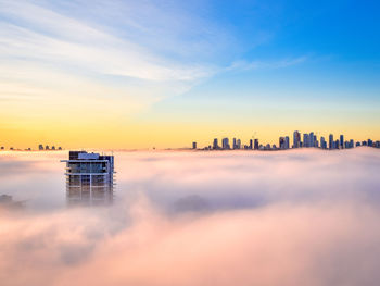 Panoramic view of buildings against sky during sunset