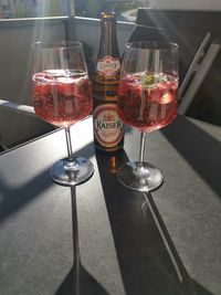 Close-up of wine glasses on table