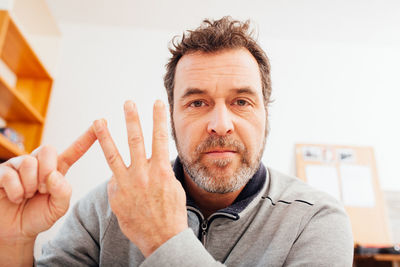 Portrait of young man against white background