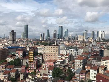 High angle view of buildings in city against sky