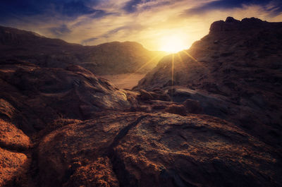 Scenic view of mountains against sky during sunset