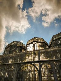 Low angle view of historical building against cloudy sky