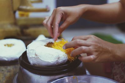 Close-up of person preparing food