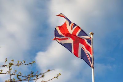 Low angle view of flag against sky