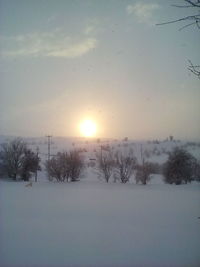 Scenic view of landscape against sky during winter