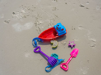 High angle view of toys on beach