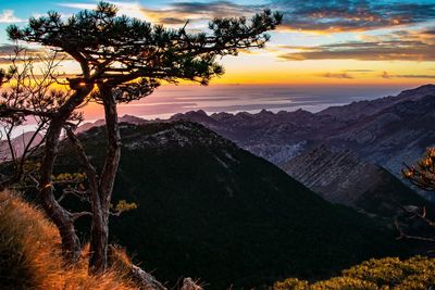 Scenic view of mountains against sky during sunset