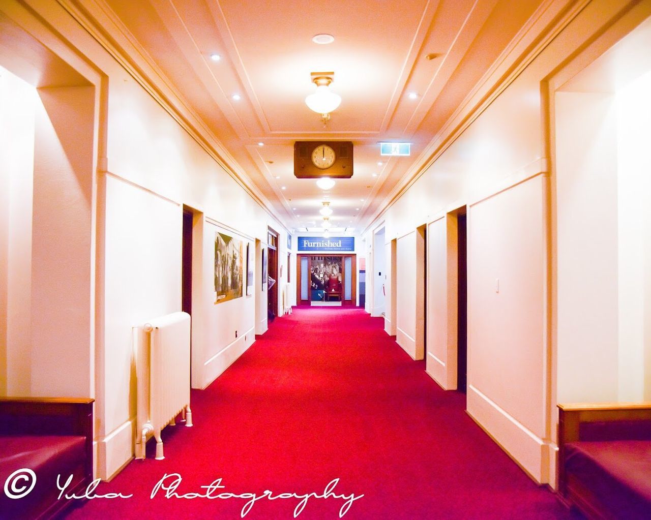 arcade, corridor, indoors, illuminated, architecture, the way forward, empty, lighting equipment, building, direction, no people, ceiling, diminishing perspective, built structure, in a row, carpet - decor, flooring, entrance, absence, door, luxury