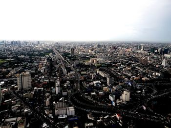 High angle view of city buildings against sky