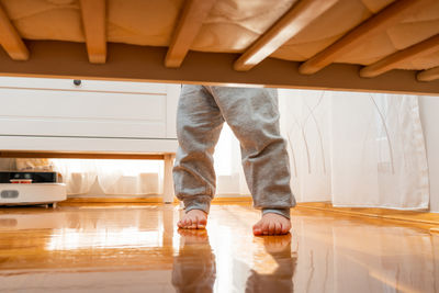 Low section of woman standing on floor