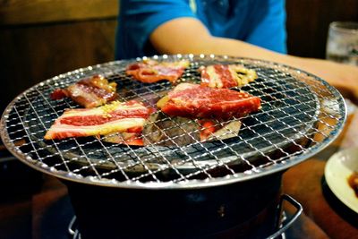 Close-up of meat on barbecue grill